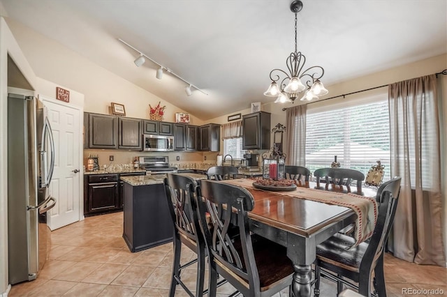 23634 Broadmoor Dr, Parker, CO 80138 - dining room with track lighting, a chandelier, light tile patterned floors, and lofted ceiling