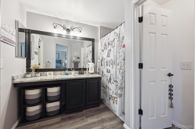 23634 Broadmoor Dr, Parker, CO 80138 - full bath featuring wood finished floors, vanity, and a shower with shower curtain