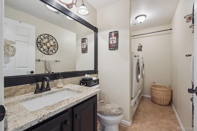 23634 Broadmoor Dr, Parker, CO 80138 - bathroom with washing machine and clothes dryer, vanity, tile patterned floors, and a shower