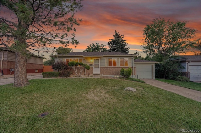3490 Mowry Pl, Westminster, CO 80031 - ranch-style home with brick siding, concrete driveway, and a lawn