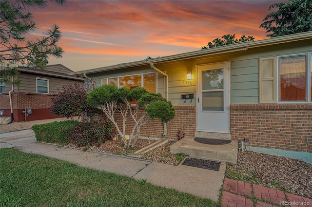 3490 Mowry Pl, Westminster, CO 80031 - exterior entry at dusk with brick siding
