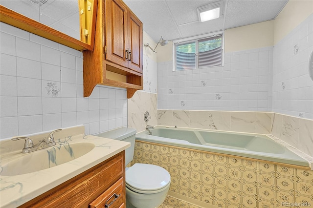 3490 Mowry Pl, Westminster, CO 80031 - bathroom featuring vanity, tile walls, and tiled shower / bath combo