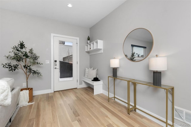 foyer featuring recessed lighting, visible vents, light wood-style flooring, and baseboards