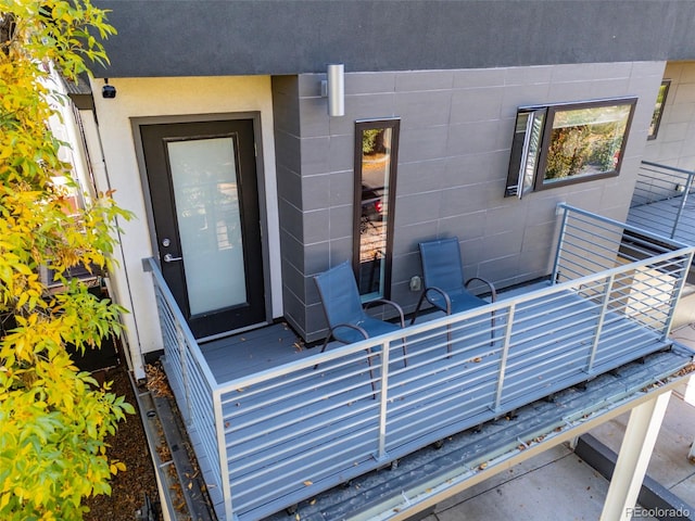 doorway to property with concrete block siding