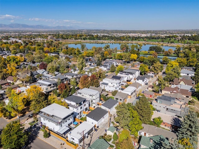 birds eye view of property with a water view and a residential view