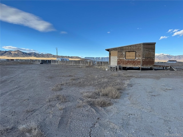 exterior space with a mountain view and a rural view