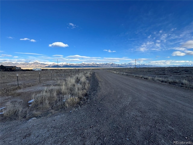 view of road featuring a rural view and a mountain view