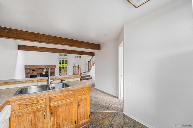 1915 S Hannibal St Unit G, Aurora, CO 80013 - kitchen featuring a sink, dishwasher, dark carpet, baseboards, and beamed ceiling