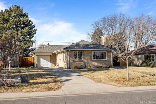 single story home with a garage and a front yard