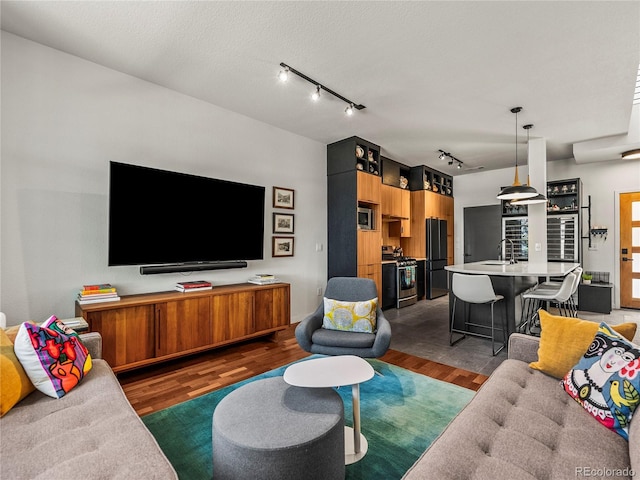 3133 Blake St Unit 3, Denver, CO 80205 - living area with track lighting and wood finished floors
