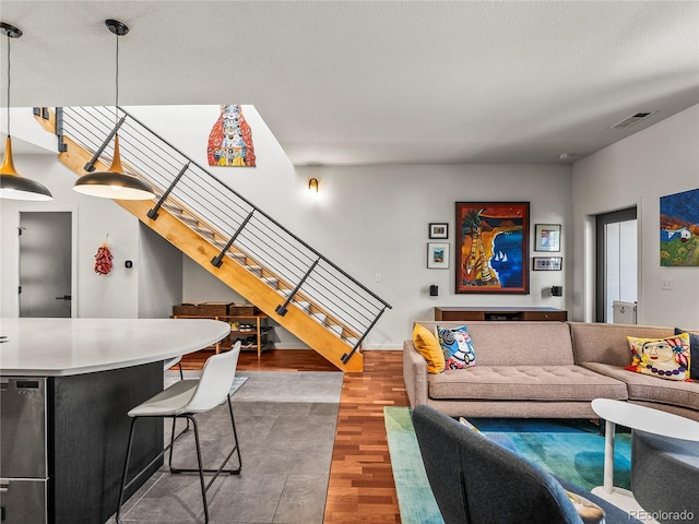 3133 Blake St Unit 3, Denver, CO 80205 - living area featuring stairs and wood finished floors