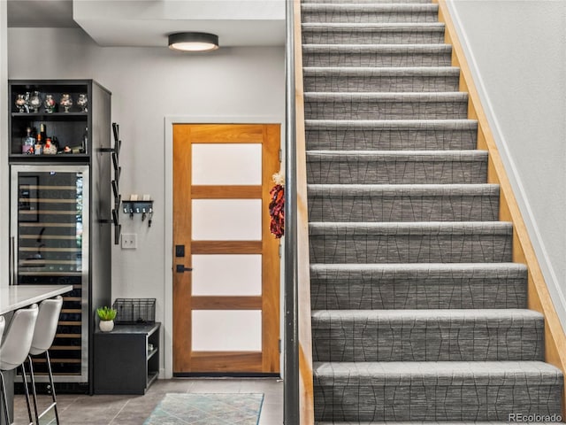 3133 Blake St Unit 3, Denver, CO 80205 - staircase with beverage cooler, tile patterned flooring, and a dry bar