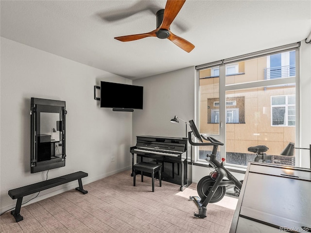 3133 Blake St Unit 3, Denver, CO 80205 - exercise room with ceiling fan, carpet floors, and baseboards
