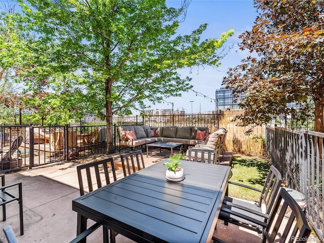 3133 Blake St Unit 3, Denver, CO 80205 - fenced backyard with an outdoor living space, a patio, and outdoor dining area