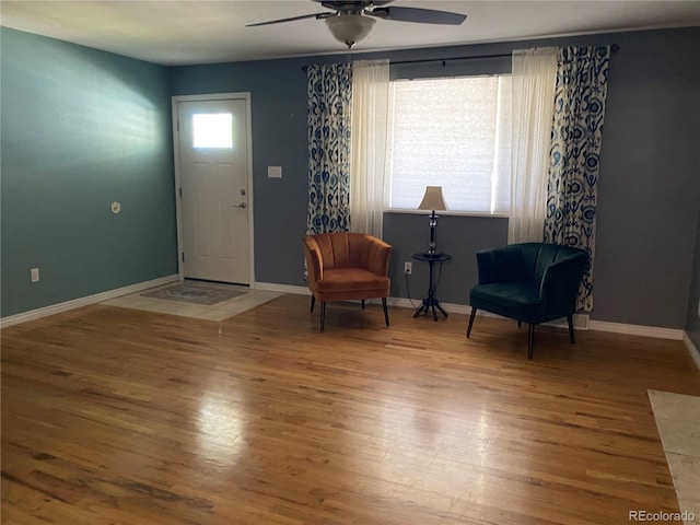 542 E Caley Dr, Centennial, CO 80121 - entrance foyer featuring wood finished floors, ceiling fan, and baseboards