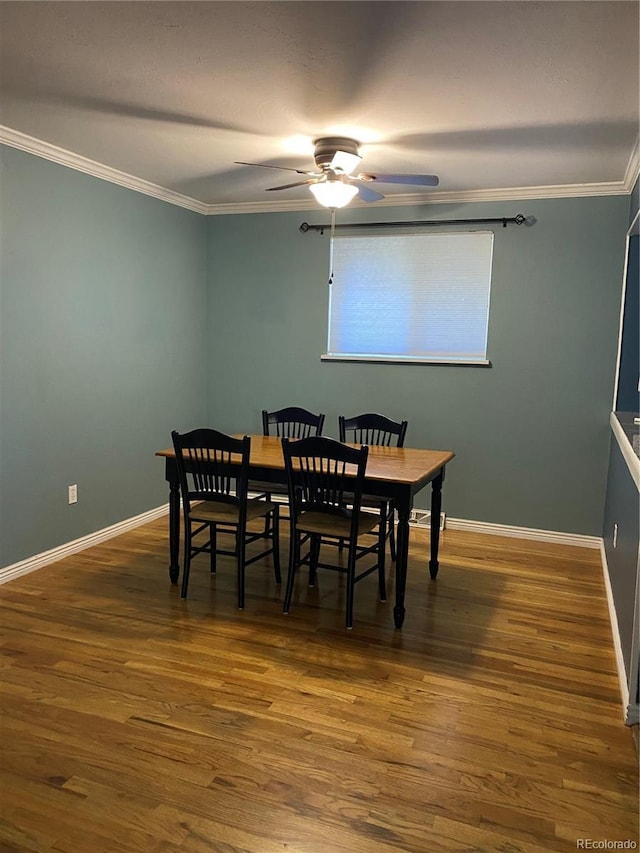 542 E Caley Dr, Centennial, CO 80121 - dining room featuring a ceiling fan, wood finished floors, ornamental molding, and baseboards