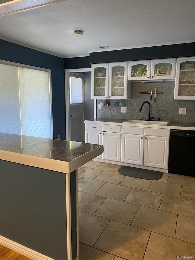 542 E Caley Dr, Centennial, CO 80121 - kitchen with a sink, black dishwasher, tasteful backsplash, tile countertops, and white cabinetry