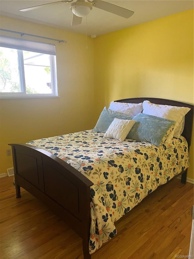 542 E Caley Dr, Centennial, CO 80121 - bedroom with wood finished floors, baseboards, and ceiling fan