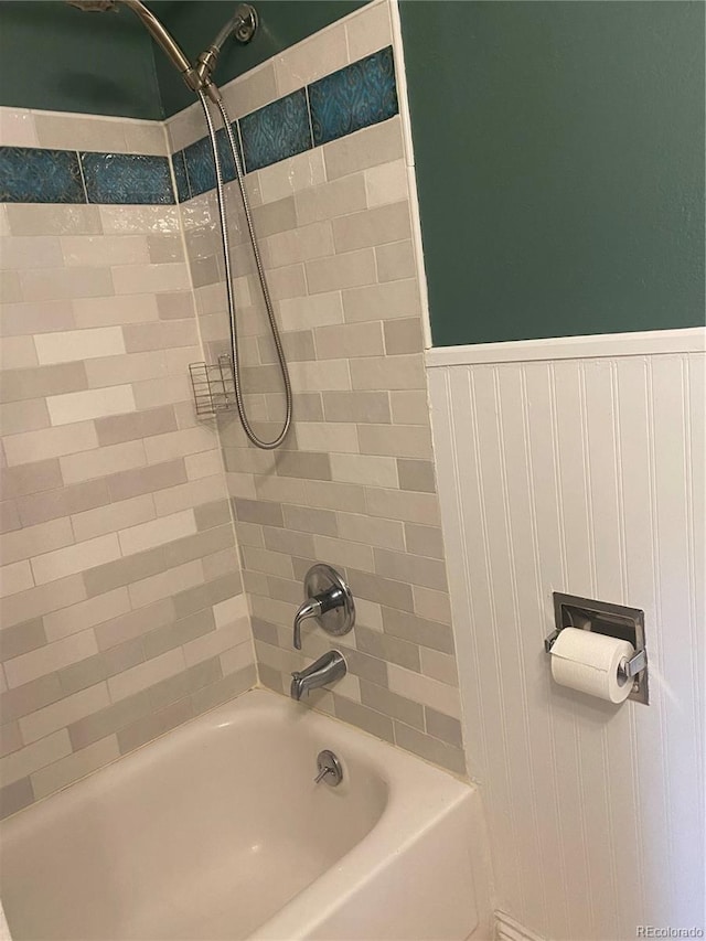542 E Caley Dr, Centennial, CO 80121 - bathroom with shower / bathtub combination and a wainscoted wall
