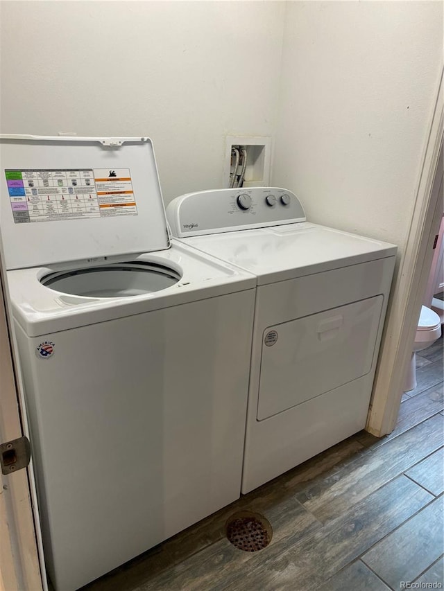 542 E Caley Dr, Centennial, CO 80121 - laundry room with dark wood-style floors and washing machine and clothes dryer