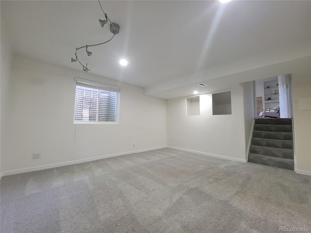 1250 Acropolis Dr, Lafayette, CO 80026 - below grade area featuring carpet floors, baseboards, stairs, and recessed lighting