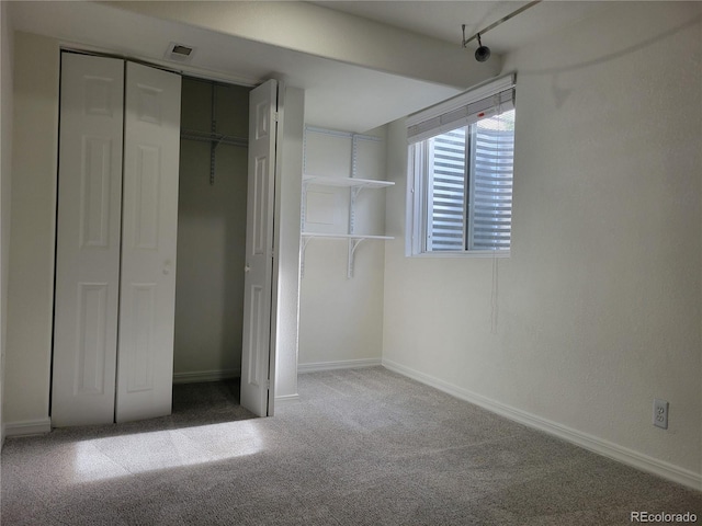1250 Acropolis Dr, Lafayette, CO 80026 - unfurnished bedroom with carpet floors, a closet, and baseboards