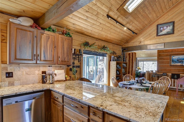 kitchen with stainless steel dishwasher, a peninsula, wooden ceiling, and vaulted ceiling