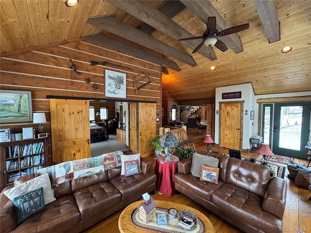 living area with wood ceiling, lofted ceiling with beams, a ceiling fan, and wood-type flooring