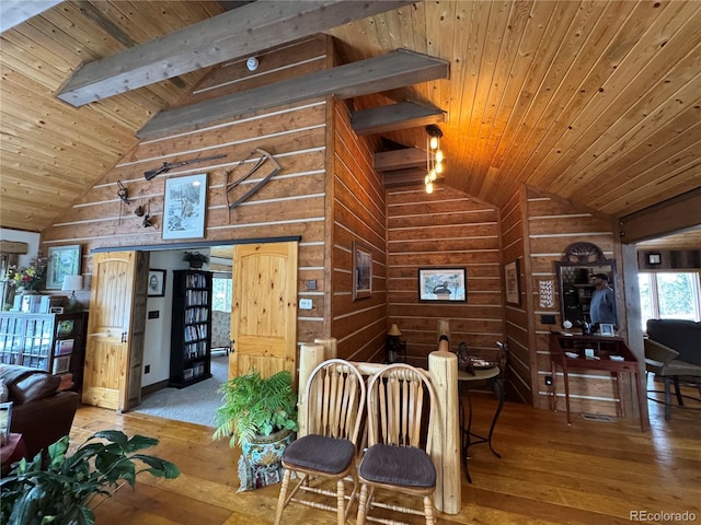 dining area with beamed ceiling, wooden ceiling, high vaulted ceiling, and light wood-type flooring