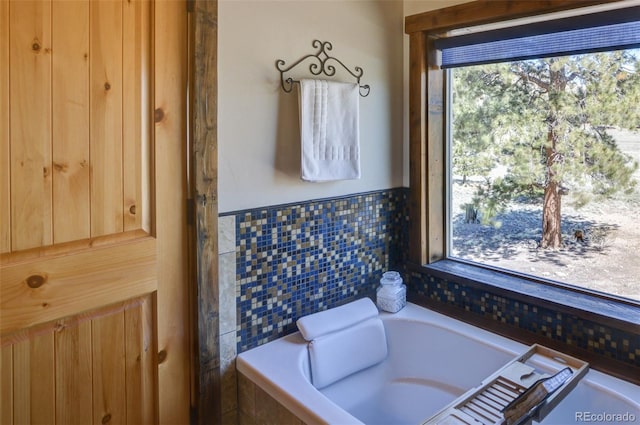 bathroom with a garden tub