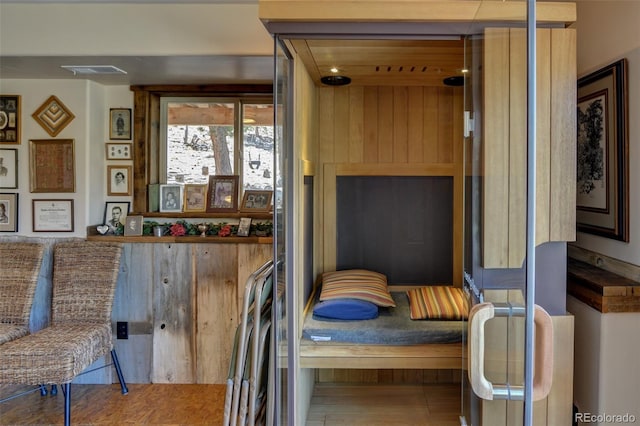 interior space with wood finished floors and visible vents