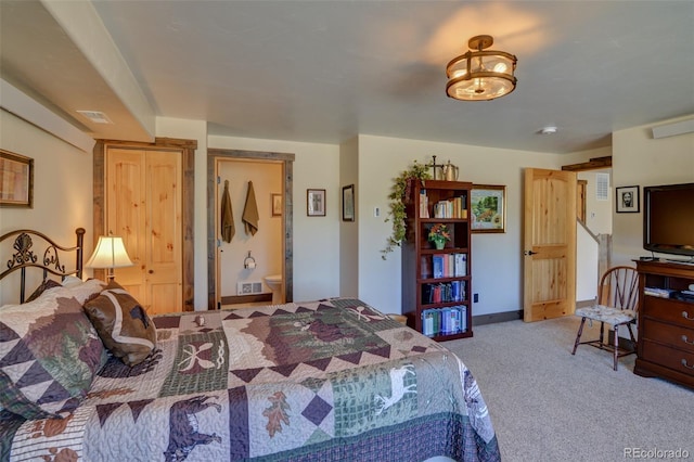 bedroom with carpet, visible vents, and baseboards