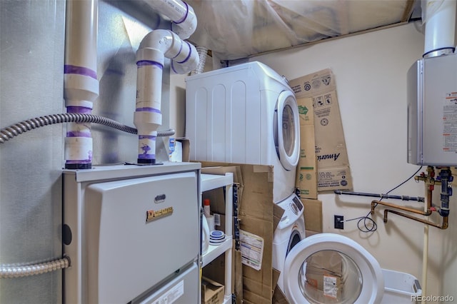 utility room featuring tankless water heater and stacked washing maching and dryer