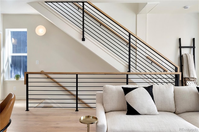 staircase with hardwood / wood-style flooring