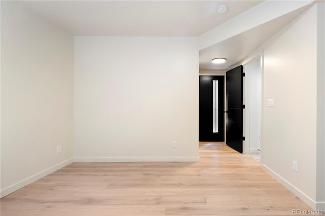 spare room featuring light hardwood / wood-style flooring