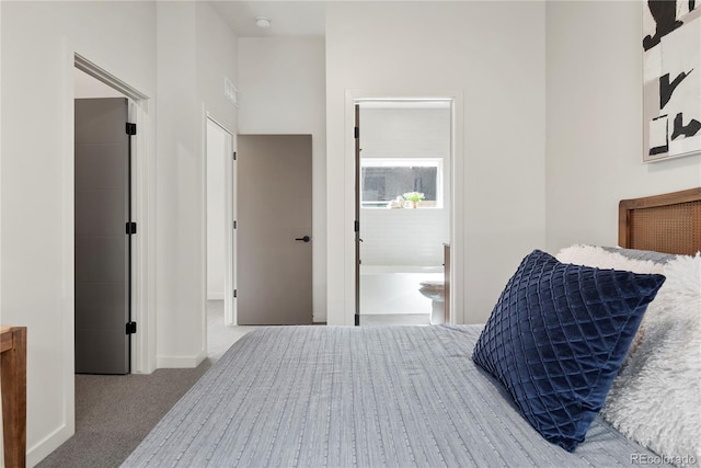 carpeted bedroom featuring connected bathroom