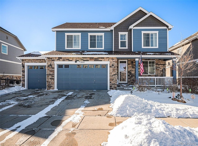 front of property featuring a garage and a porch