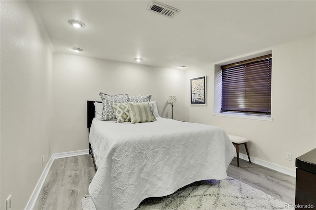 bedroom with light hardwood / wood-style flooring