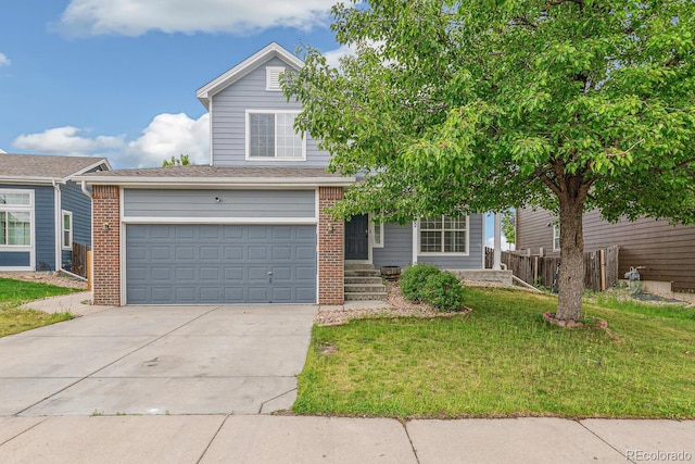 15762 Olmsted Pl, Denver, CO 80239 - view of front of house featuring brick siding, a garage, and driveway
