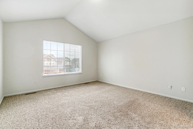 15762 Olmsted Pl, Denver, CO 80239 - unfurnished room featuring carpet, vaulted ceiling, and baseboards