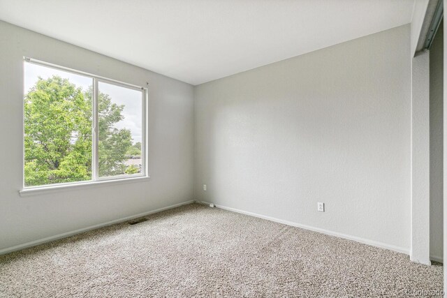 15762 Olmsted Pl, Denver, CO 80239 - unfurnished room featuring carpet floors and baseboards