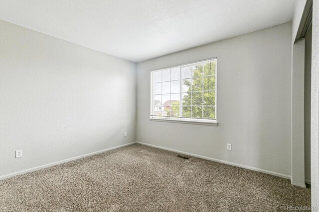 15762 Olmsted Pl, Denver, CO 80239 - spare room with carpet and baseboards