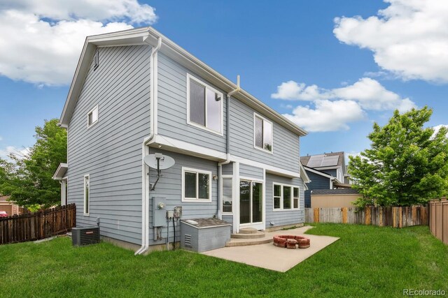 15762 Olmsted Pl, Denver, CO 80239 - back of house featuring a patio, cooling unit, and entry steps
