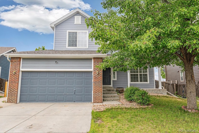 15762 Olmsted Pl, Denver, CO 80239 - traditional-style home featuring driveway, brick siding, and a garage