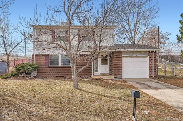 view of front of property with a garage and a front yard