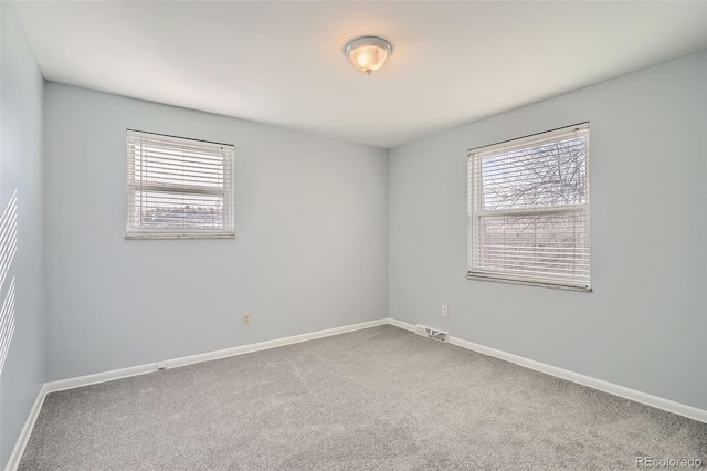 spare room featuring carpet flooring