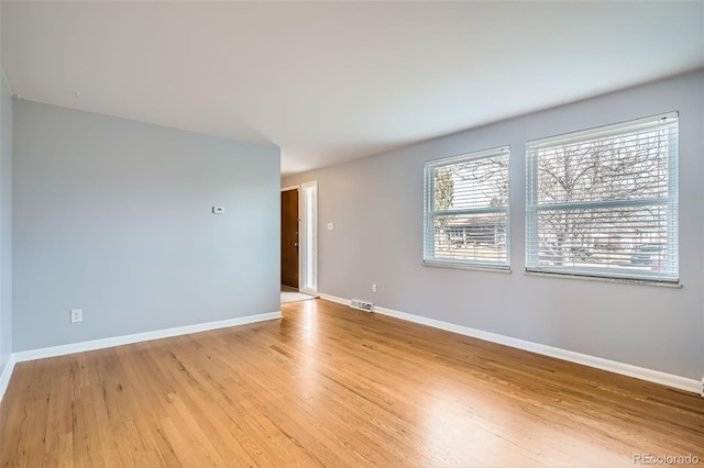 unfurnished room featuring light hardwood / wood-style floors