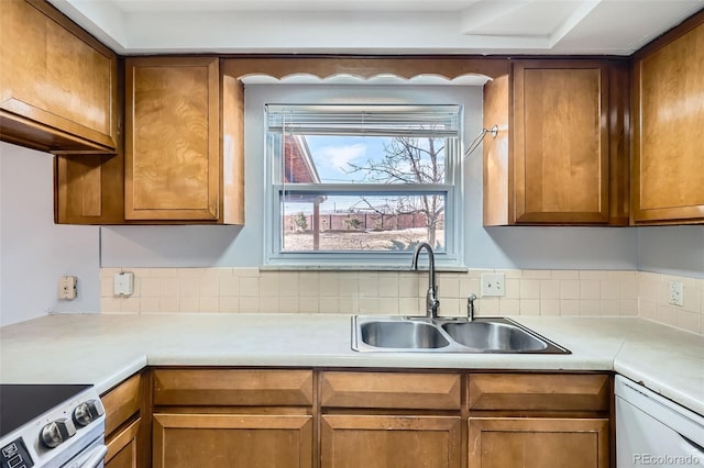 kitchen with stainless steel range with electric stovetop, dishwasher, and sink