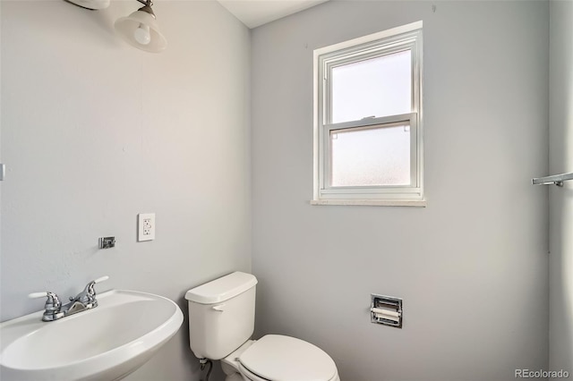 bathroom with sink and toilet