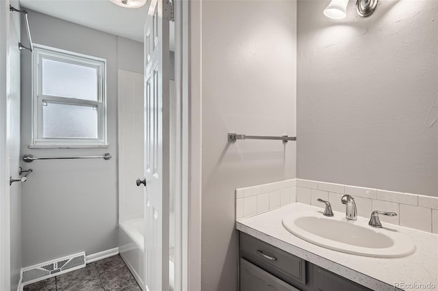 bathroom featuring vanity and washtub / shower combination